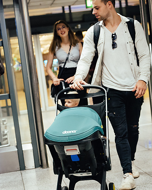 Doona Doona+, Seggiolino Auto Gruppo 0+ con Ruote 2-in-1, Verde Racing - Approvato come passeggino! Seggiolini Auto Gruppo 0+/1