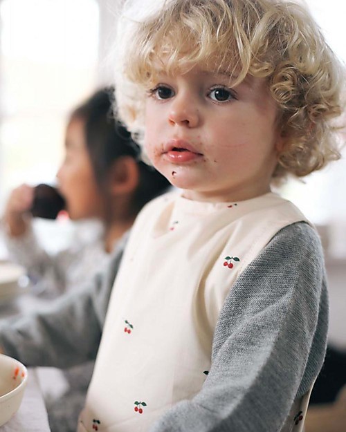 Konges Slojd Bavaglino Senza Maniche - Ciliegia Bavagli Impermeabili con Tasca